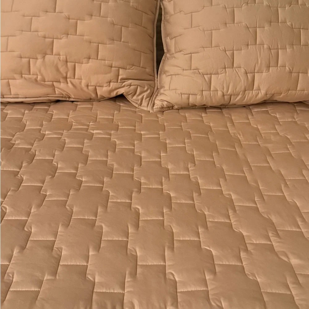 Brand new Crate & Barrel golden tan quilt with 2 standard sized shams
